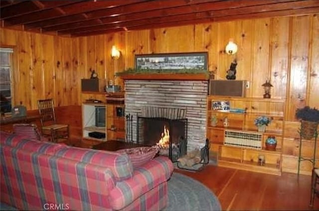 29053 Cedar Ter, Lake Arrowhead, CA 92321 - living area with beam ceiling, wood finished floors, wood walls, and a fireplace