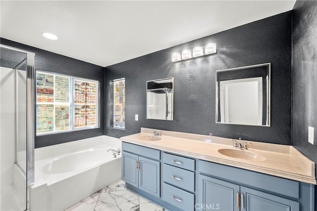 29889 Warm Sands Dr, Menifee, CA 92584 - full bath with a textured wall, marble look tiles, a bath, and double vanity