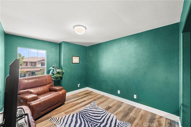 29889 Warm Sands Dr, Menifee, CA 92584 - sitting room featuring wood finished floors and baseboards