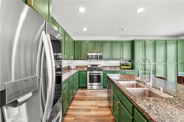 29889 Warm Sands Dr, Menifee, CA 92584 - kitchen featuring stainless steel appliances, green cabinetry, a sink, and recessed lighting