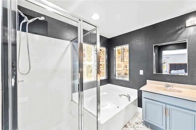 29889 Warm Sands Dr, Menifee, CA 92584 - bathroom featuring a stall shower, a garden tub, vanity, a textured wall, and marble look tiles