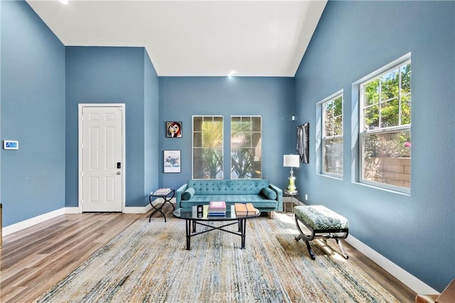 29889 Warm Sands Dr, Menifee, CA 92584 - living room with wood finished floors, baseboards, and vaulted ceiling