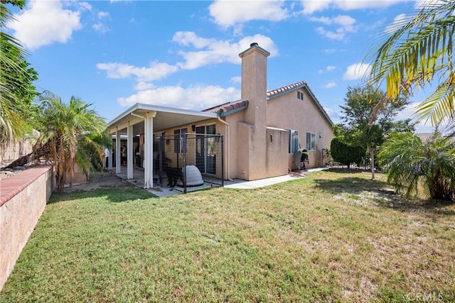 959 Corwin Pl, Hemet, CA 92544 - back of house with a chimney, a patio area, a lawn, and stucco siding