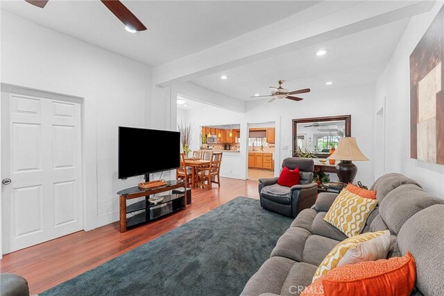 1040 W 3rd St, Pomona, CA 91766 - living room featuring a ceiling fan, wood finished floors, and recessed lighting
