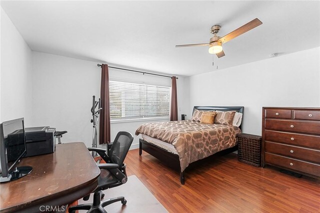 1040 W 3rd St, Pomona, CA 91766 - bedroom featuring wood finished floors, a desk, and ceiling fan