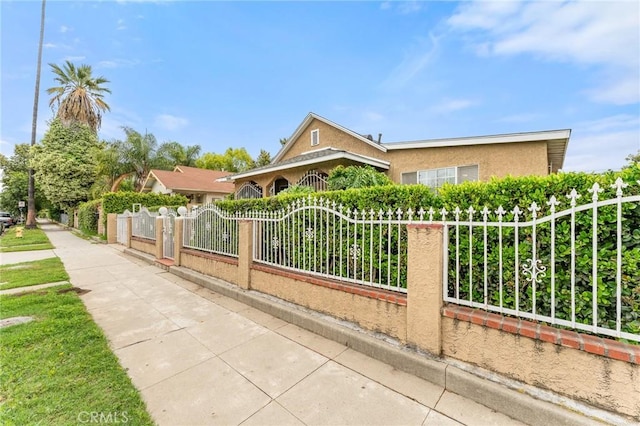 1040 W 3rd St, Pomona, CA 91766 - view of front of house featuring stucco siding