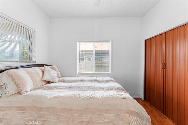 1040 W 3rd St, Pomona, CA 91766 - bedroom featuring wood finished floors