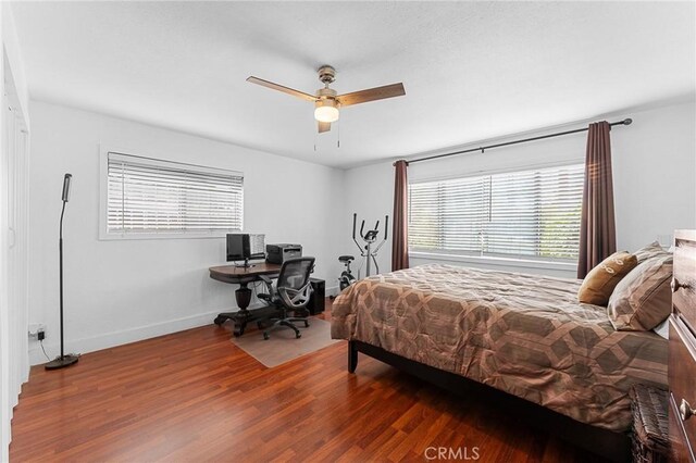 1040 W 3rd St, Pomona, CA 91766 - bedroom with wood finished floors, baseboards, an office area, and ceiling fan