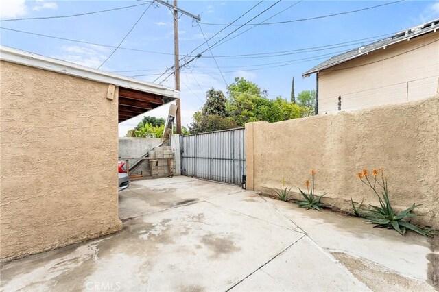 1040 W 3rd St, Pomona, CA 91766 - view of patio / terrace with a gate