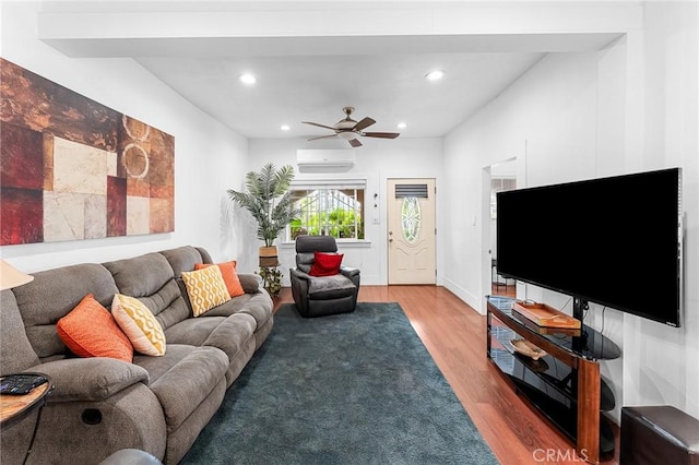 1040 W 3rd St, Pomona, CA 91766 - living room featuring wood finished floors, recessed lighting, a ceiling fan, and an AC wall unit