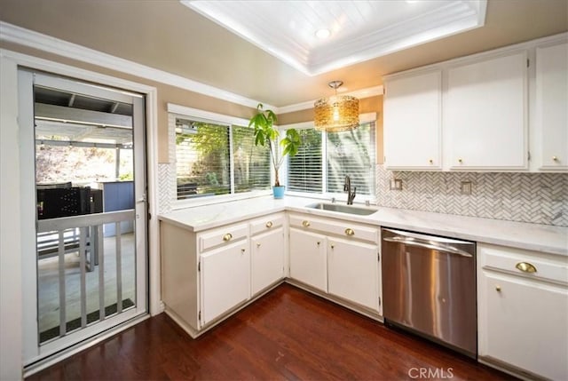 29911 Cactus Pl, Temecula, CA 92592 - kitchen with stainless steel dishwasher, a sink, a raised ceiling, light countertops, and crown molding