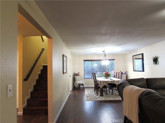 1575 Santa Inez Ct, Merced, CA 95340 - dining space featuring stairs, dark wood-type flooring, and baseboards