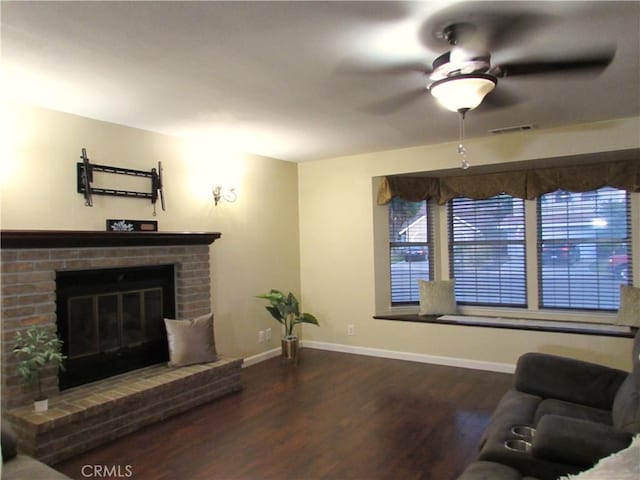 1575 Santa Inez Ct, Merced, CA 95340 - living room featuring wood finished floors, ceiling fan, baseboards, and a fireplace