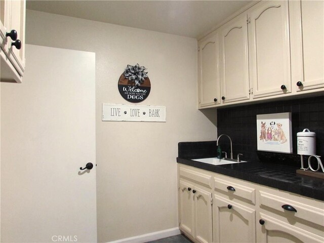 1575 Santa Inez Ct, Merced, CA 95340 - washroom featuring a sink and baseboards
