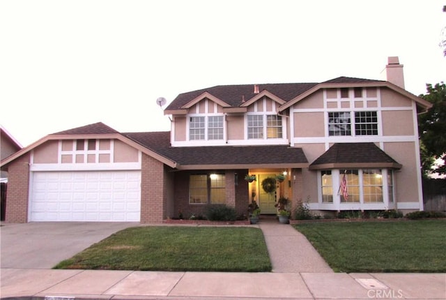 1575 Santa Inez Ct, Merced, CA 95340 - view of front of property with a garage, driveway, a chimney, a front yard, and brick siding