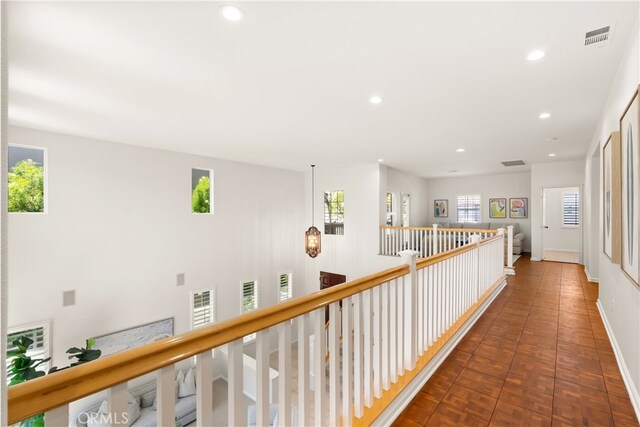19139 Chandon Ln, Huntington Beach, CA 92648 - hallway with plenty of natural light, recessed lighting, baseboards, and an upstairs landing
