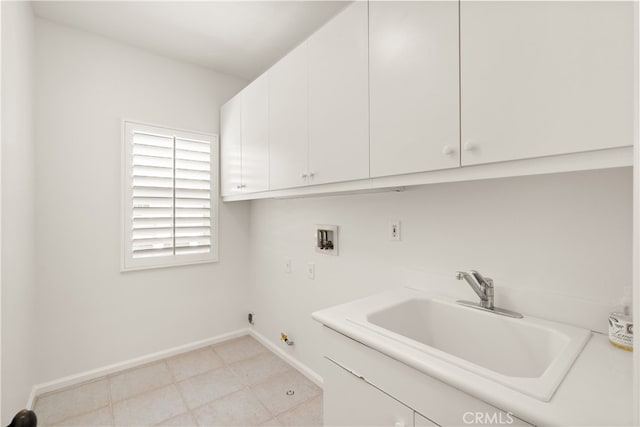 19139 Chandon Ln, Huntington Beach, CA 92648 - laundry area featuring cabinet space, washer hookup, and baseboards