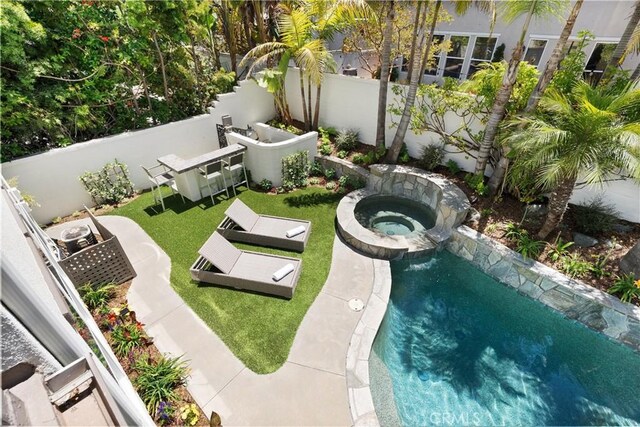 19139 Chandon Ln, Huntington Beach, CA 92648 - view of swimming pool with a fenced backyard and a pool with connected hot tub