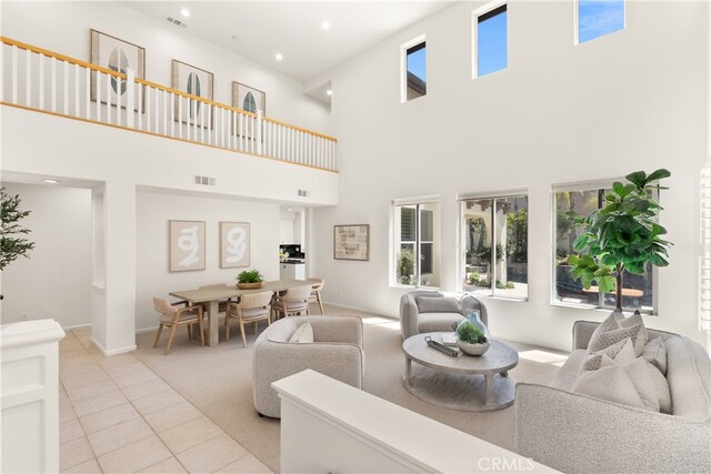 19139 Chandon Ln, Huntington Beach, CA 92648 - living area featuring a high ceiling, light tile patterned floors, baseboards, and recessed lighting