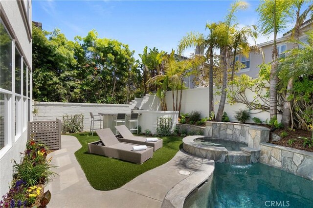 19139 Chandon Ln, Huntington Beach, CA 92648 - fenced backyard featuring a pool with connected hot tub and a patio
