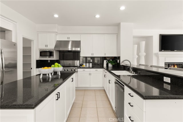 19139 Chandon Ln, Huntington Beach, CA 92648 - kitchen featuring extractor fan, a sink, appliances with stainless steel finishes, a peninsula, and white cabinets