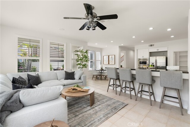 19139 Chandon Ln, Huntington Beach, CA 92648 - living room with light tile patterned floors, recessed lighting, and a ceiling fan