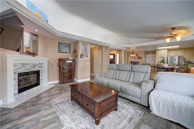 1121 Rose Ct, Grover Beach, CA 93433 - living area featuring a fireplace, light wood-style flooring, ceiling fan, and baseboards