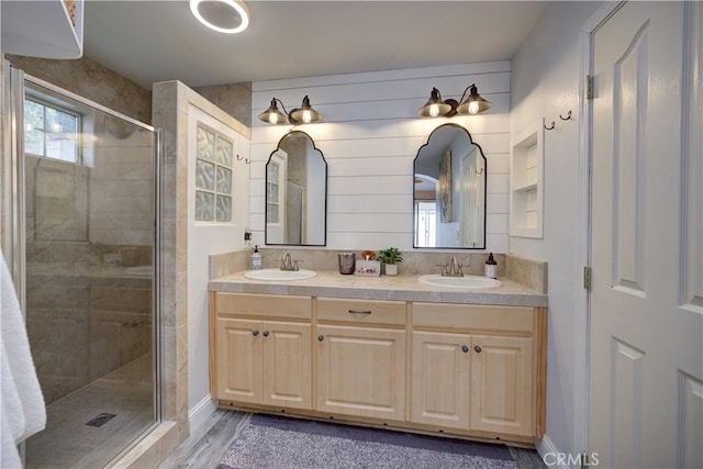 1121 Rose Ct, Grover Beach, CA 93433 - full bath featuring a shower stall, double vanity, baseboards, and wood finished floors
