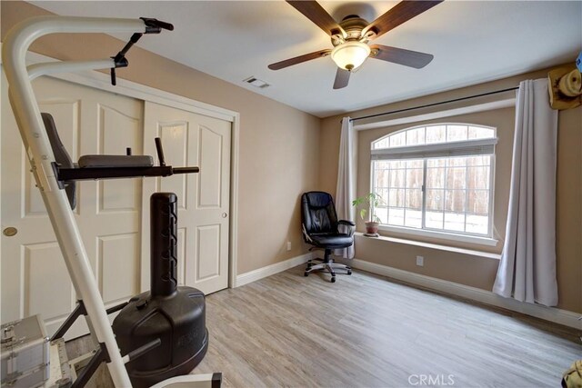 1121 Rose Ct, Grover Beach, CA 93433 - exercise area featuring baseboards, light wood-type flooring, and ceiling fan