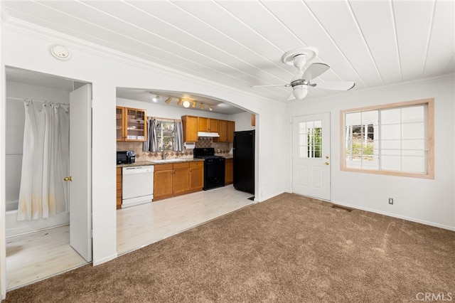 1244 Bear Springs Rd, Twin Peaks, CA 92391 - kitchen featuring black appliances, light colored carpet, brown cabinetry, ornamental molding, and a ceiling fan