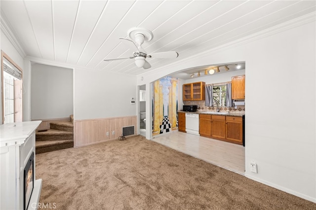 1244 Bear Springs Rd, Twin Peaks, CA 92391 - unfurnished living room featuring light colored carpet, ornamental molding, a wainscoted wall, ceiling fan, and a sink