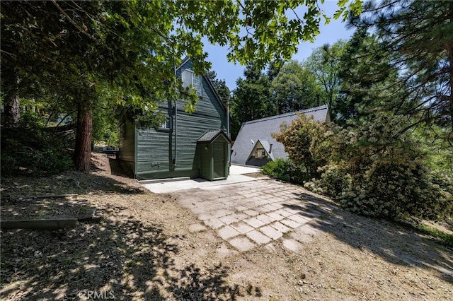 1244 Bear Springs Rd, Twin Peaks, CA 92391 - rear view of house with a patio