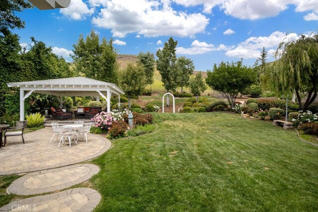 6505 Smoke Tree Ave, Oak Park, CA 91377 - view of green lawn featuring a gazebo and a patio