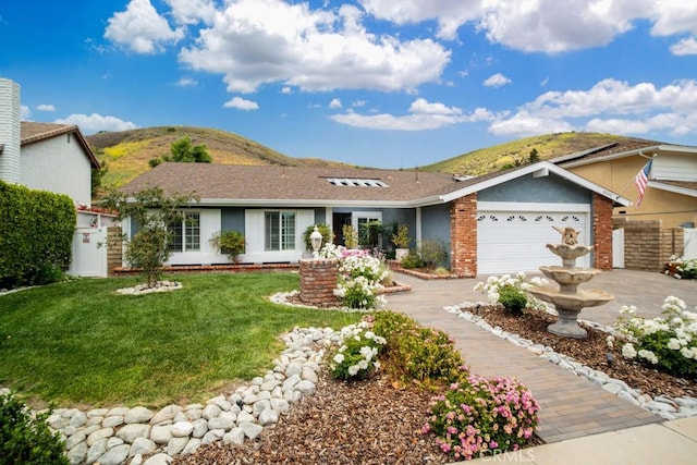 6505 Smoke Tree Ave, Oak Park, CA 91377 - ranch-style house featuring a garage, driveway, and a mountain view