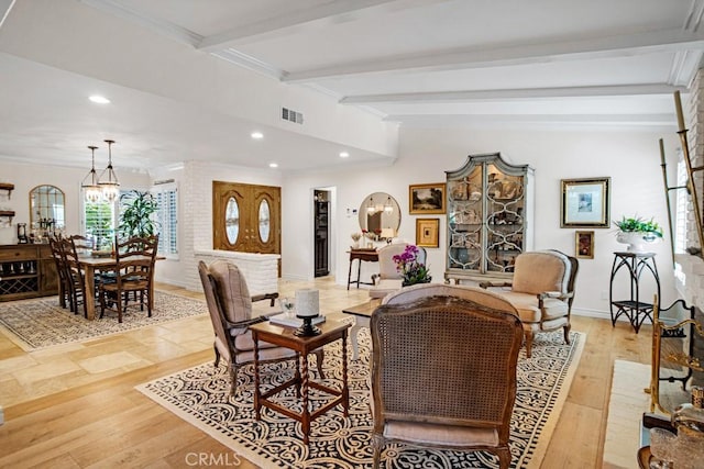 6505 Smoke Tree Ave, Oak Park, CA 91377 - living room featuring beamed ceiling, a chandelier, recessed lighting, light wood finished floors, and ornamental molding