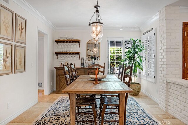 6505 Smoke Tree Ave, Oak Park, CA 91377 - dining room with stone tile floors, crown molding, and baseboards
