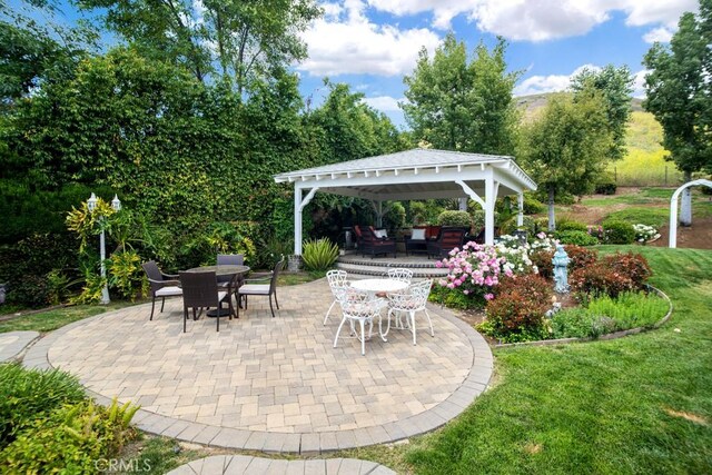 6505 Smoke Tree Ave, Oak Park, CA 91377 - view of patio / terrace featuring a gazebo, outdoor lounge area, and outdoor dining area