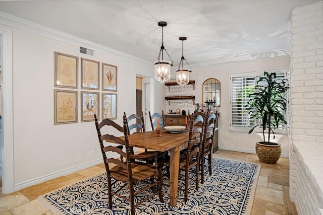 6505 Smoke Tree Ave, Oak Park, CA 91377 - dining room featuring stone tile flooring, a chandelier, crown molding, and baseboards