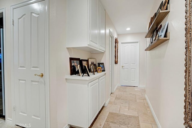 6505 Smoke Tree Ave, Oak Park, CA 91377 - hall with stone tile floors, baseboards, and recessed lighting