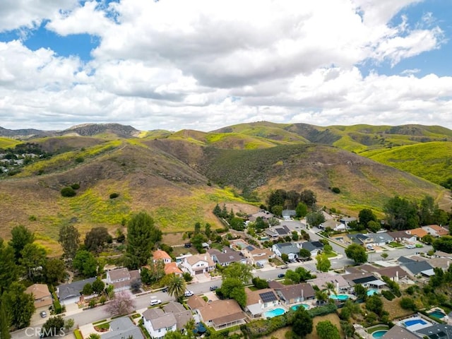 6505 Smoke Tree Ave, Oak Park, CA 91377 - aerial overview of property's location featuring a mountain backdrop and nearby suburban area