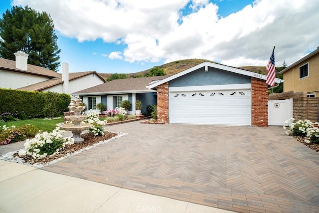 6505 Smoke Tree Ave, Oak Park, CA 91377 - single story home featuring decorative driveway and stucco siding
