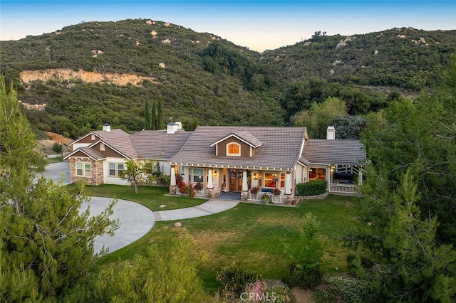 41275 Hacienda Dr, Murrieta, CA 92562 - view of front facade with a chimney, a porch, and a mountain view