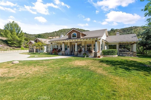 41275 Hacienda Dr, Murrieta, CA 92562 - view of front facade with covered porch, a chimney, and a front lawn