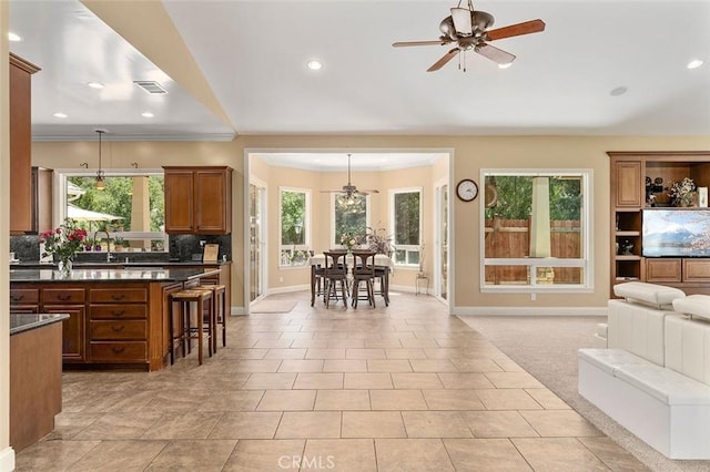 41275 Hacienda Dr, Murrieta, CA 92562 - living room with a ceiling fan, baseboards, recessed lighting, ornamental molding, and light tile patterned flooring