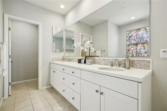 114 Desert Lotus, Irvine, CA 92618 - full bath with double vanity, backsplash, tile patterned flooring, baseboards, and recessed lighting