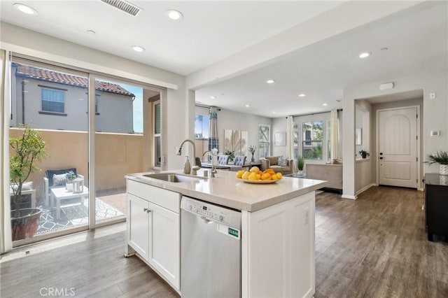 114 Desert Lotus, Irvine, CA 92618 - kitchen with dishwasher, a sink, white cabinets, recessed lighting, and a center island with sink