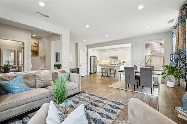 114 Desert Lotus, Irvine, CA 92618 - living area with light wood-style flooring and recessed lighting