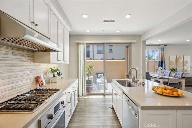 114 Desert Lotus, Irvine, CA 92618 - kitchen featuring a sink, dishwasher, under cabinet range hood, wall oven, and gas cooktop