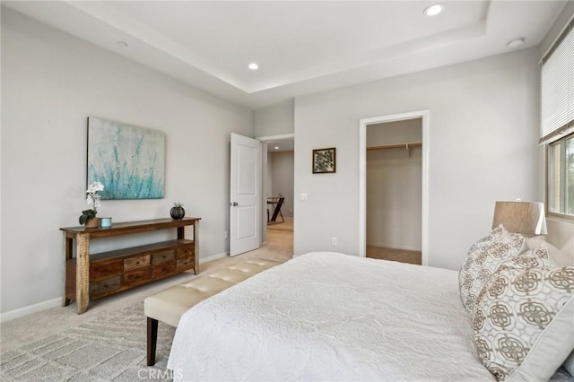 114 Desert Lotus, Irvine, CA 92618 - bedroom with recessed lighting, carpet flooring, a raised ceiling, baseboards, and a walk in closet