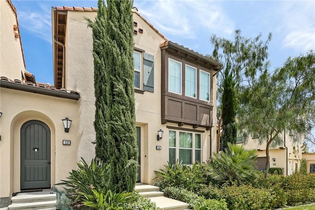 114 Desert Lotus, Irvine, CA 92618 - view of front of house with stucco siding